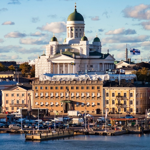 Aerial scenery panorama view city embankment of Helsinki, capital of Finland with blue evening sky. Background of amazing urban scenic view of Scandinavian finnish architecture. Copy text space