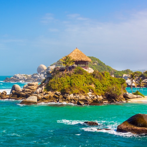 Turquoise water and beach shack at Cabo San Juan del Guia in Tayrona National Park in Colombia